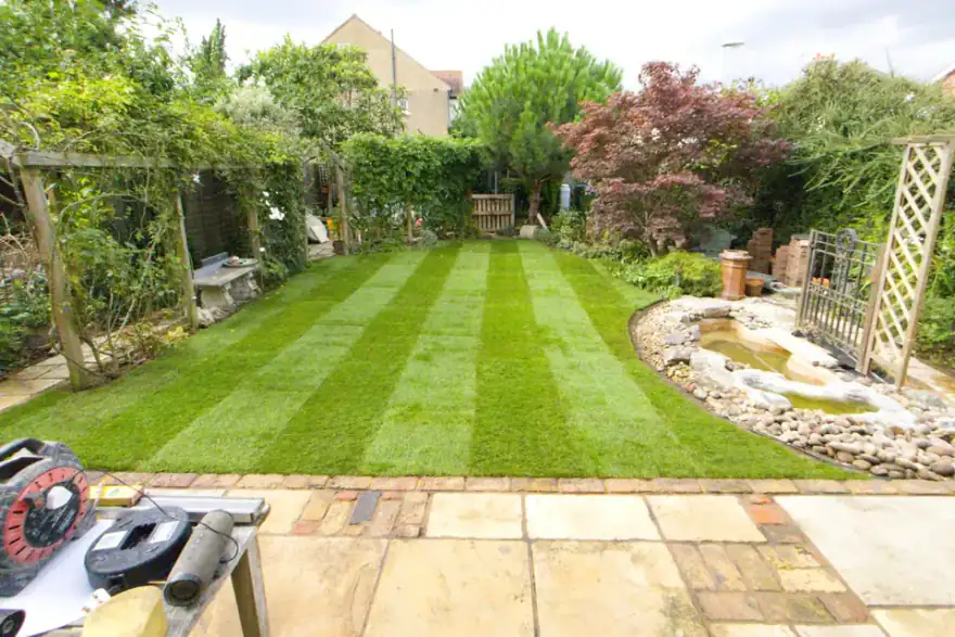 Artificial grass installation by Above & Beyond Landscapes