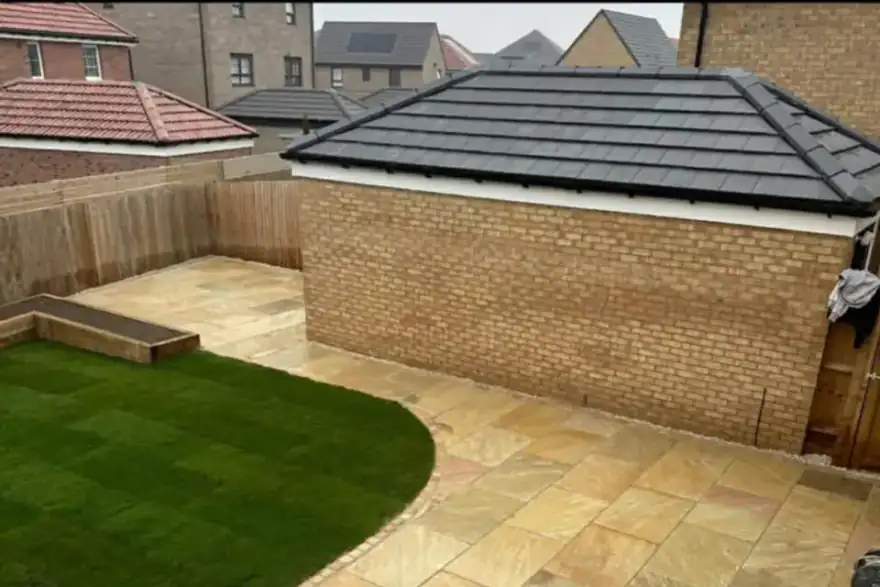 Contemporary garden with paving and artificial grass