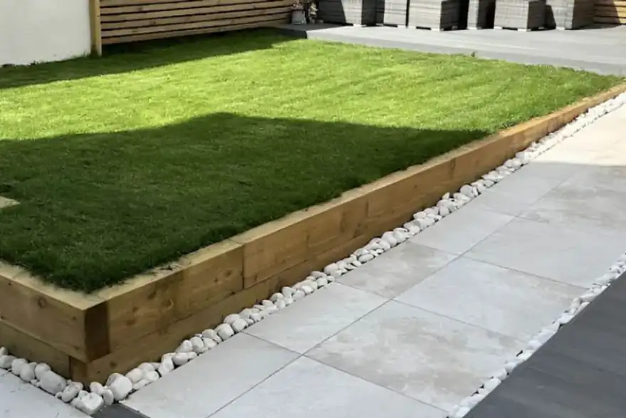 Garden makeover featuring porcelain, composite decking, and Venetian fencing for a stylish outdoor space