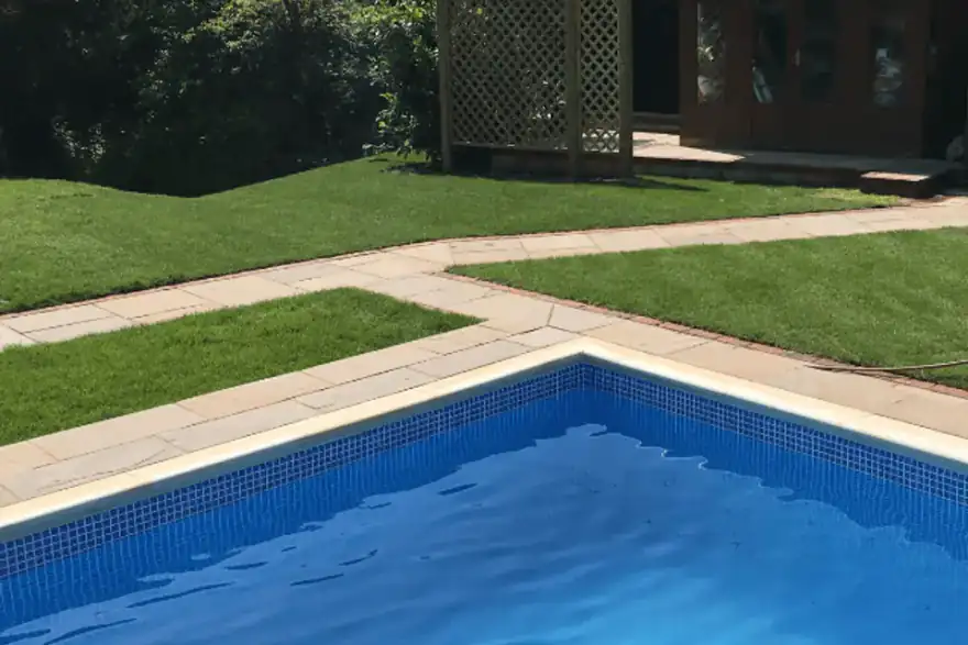 Professionally landscaped garden with swimming pool by Element Landscapes