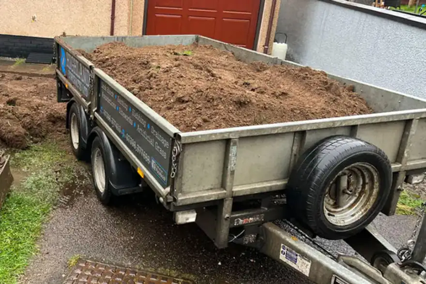 Freshly dug-up mud in a trailer