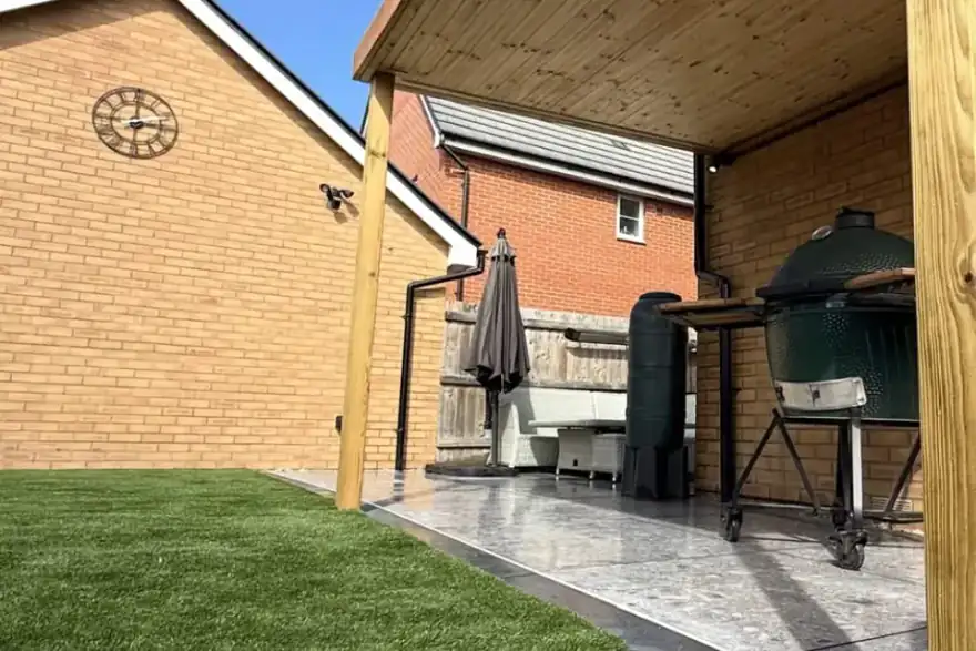 Premium artificial lawn and astroturf with porcelain patio and timber pergola