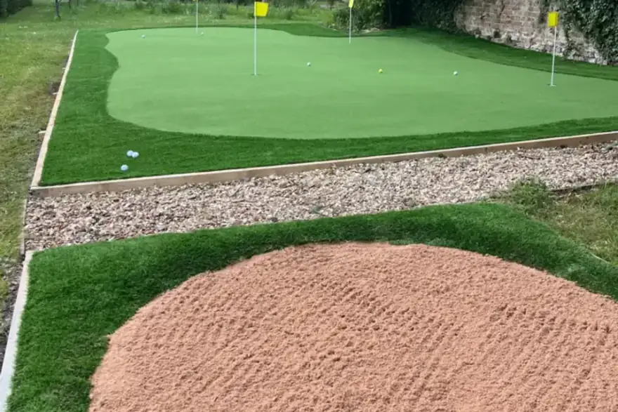 Putting green with fake grass installed in Herfordshire with bunker