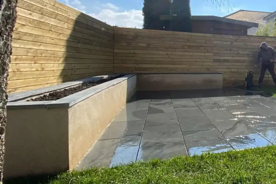 A modern stone patio installed by trusted **landscapers in Bournemouth**.