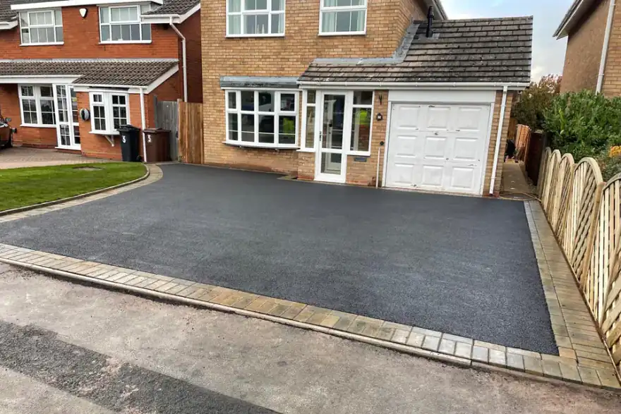 Artificial grass installation by Signature Driveways. Inspired Landscapes.