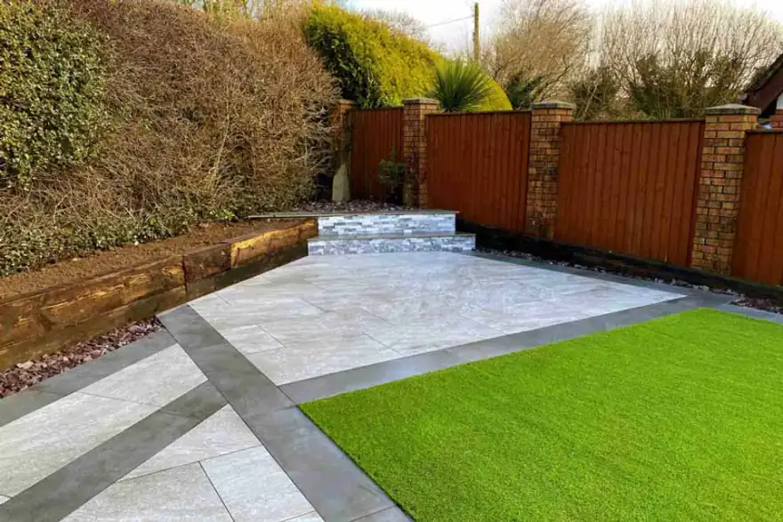 Full landscape gardening projects including fencing, raises sleeper beds, porcelain stone path, patio and artificial grass turf at a property in North Wales.